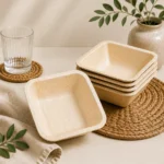 Square natural-tone bowls with rounded corners and deeper sides for a compact tableware profile.
