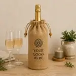 Jute drawstring bottle gift bag with a custom logo panel.