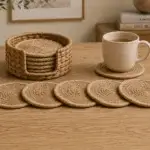 Round spiral-braided coasters paired with a matching open-front woven holder for neat tabletop storage.