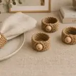 Textured natural-tone napkin rings finished with a round bead detail for a relaxed table setting.