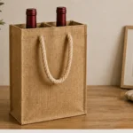 A natural-tone gift carrier with two bottle openings and rope handles for an understated presentation.