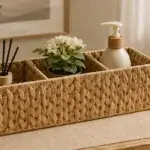 A long rectangular woven organiser for arranging bottles, jars and everyday countertop accessories.