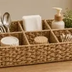 A rectangular woven organiser divided into separate compartments for sorting tabletop and household essentials.
