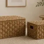 Rectangular woven storage boxes with fitted lids and inset side hand openings.
